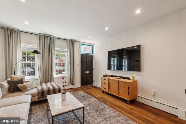 1011 Dickinson St, Philadelphia, PA 19147 - living room featuring baseboard heating, wood finished floors, and recessed lighting