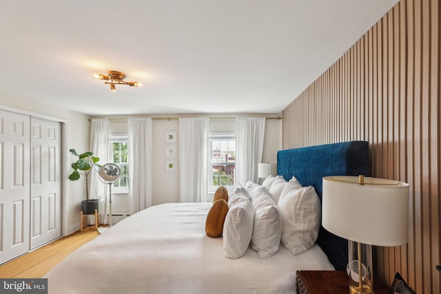 1011 Dickinson St, Philadelphia, PA 19147 - bedroom featuring wood finished floors, a closet, and a baseboard radiator