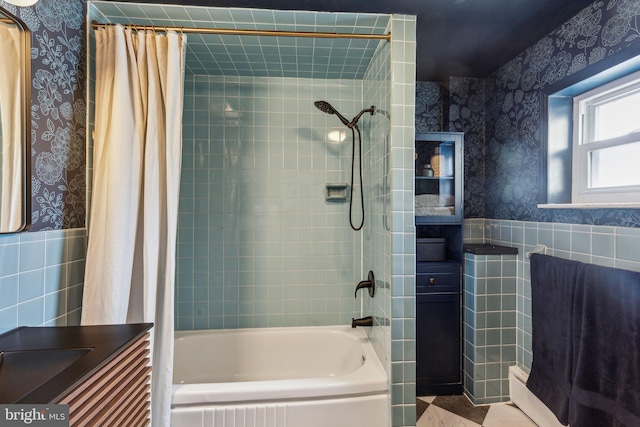 1011 Dickinson St, Philadelphia, PA 19147 - bathroom featuring wallpapered walls, tile walls, shower / bath combination with curtain, wainscoting, and vanity
