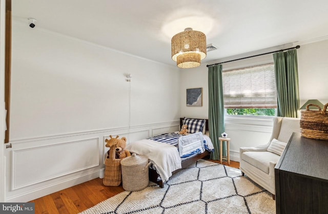 2218 Oakwood Ln, Atco, NJ 08004 - bedroom with wood finished floors, crown molding, and a wainscoted wall
