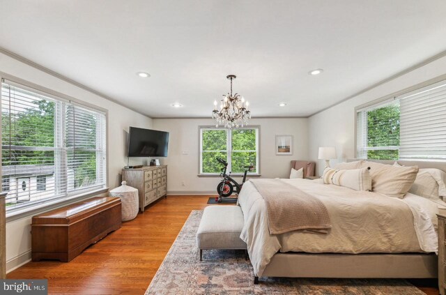 2218 Oakwood Ln, Atco, NJ 08004 - bedroom featuring multiple windows, a chandelier, wood finished floors, baseboards, and recessed lighting