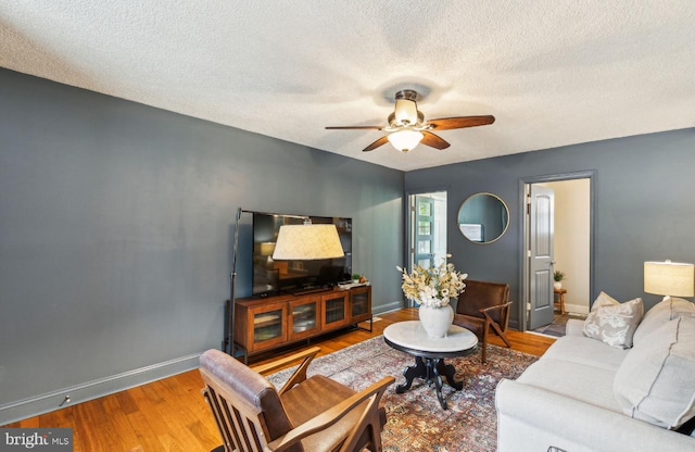 2218 Oakwood Ln, Atco, NJ 08004 - living area with ceiling fan, baseboards, a textured ceiling, and wood finished floors