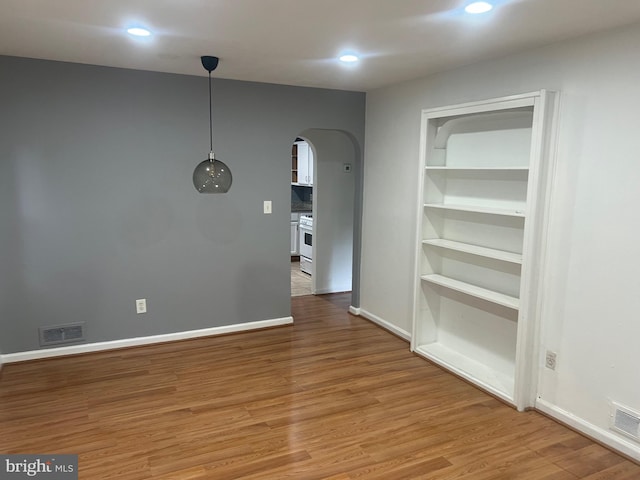 3403 Murdock Rd, Kensington, MD 20895 - spare room with arched walkways, light wood-type flooring, recessed lighting, and baseboards