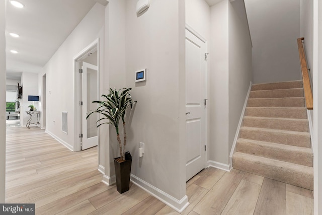 6411 Tulip Ter, Haymarket, VA 20169 - staircase with wood finished floors, recessed lighting, and baseboards