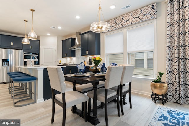 6411 Tulip Ter, Haymarket, VA 20169 - dining room featuring a chandelier, light wood-type flooring, baseboards, and recessed lighting