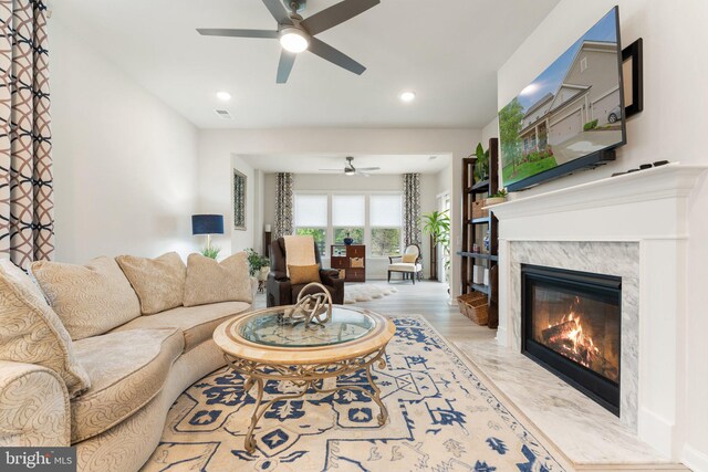 6411 Tulip Ter, Haymarket, VA 20169 - living room featuring ceiling fan, a high end fireplace, recessed lighting, and wood finished floors
