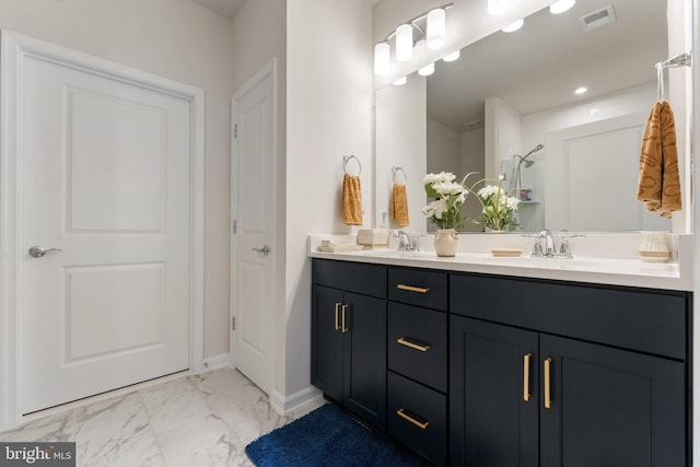 6411 Tulip Ter, Haymarket, VA 20169 - full bath with double vanity, marble finish flooring, a shower, and baseboards