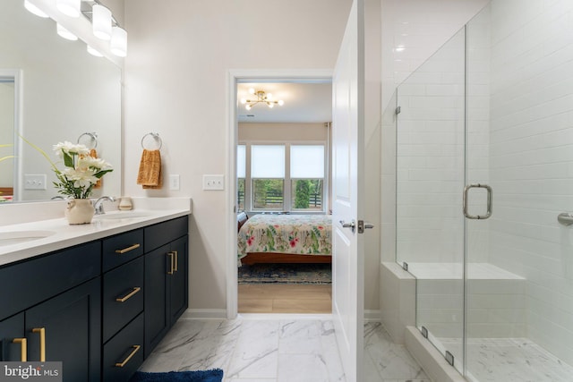 6411 Tulip Ter, Haymarket, VA 20169 - full bath featuring double vanity, connected bathroom, a shower stall, baseboards, and marble finish flooring