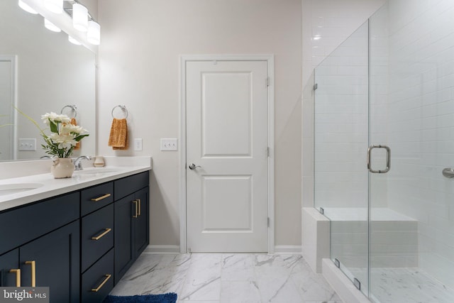 6411 Tulip Ter, Haymarket, VA 20169 - bathroom with double vanity, a shower stall, marble finish floors, and baseboards
