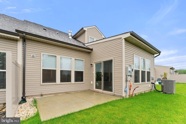 6411 Tulip Ter, Haymarket, VA 20169 - rear view of house with central AC, a patio area, and a yard