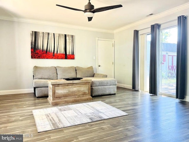 159 Harwich St, Browns Mills, NJ 08015 - living room featuring baseboards, ornamental molding, wood finished floors, and ceiling fan