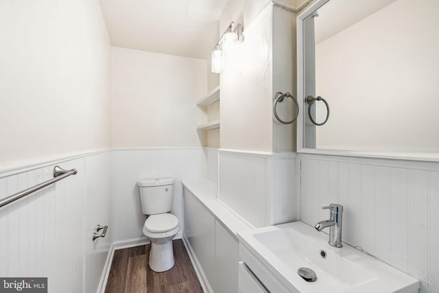 820 Cumberland St, Gloucester City, NJ 08030 - bathroom with wainscoting, toilet, vanity, and wood finished floors