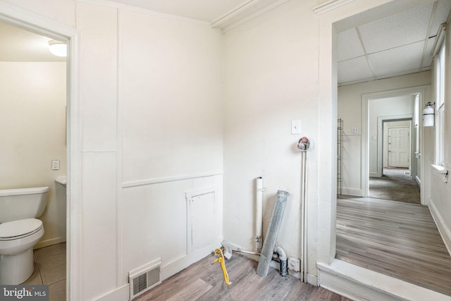 820 Cumberland St, Gloucester City, NJ 08030 - bathroom featuring wood finished floors, toilet, baseboards, and a paneled ceiling