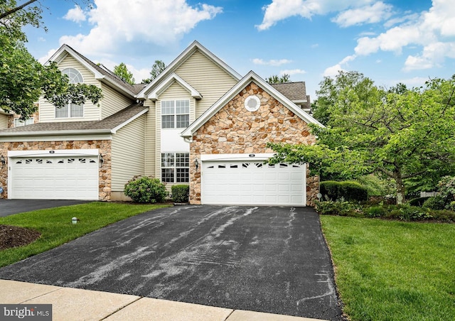 256 Silverbell Ct, West Chester, PA 19380 - traditional home featuring stone siding, driveway, a front yard, and roof with shingles