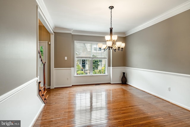 256 Silverbell Ct, West Chester, PA 19380 - empty room featuring a chandelier, hardwood / wood-style flooring, crown molding, and baseboards
