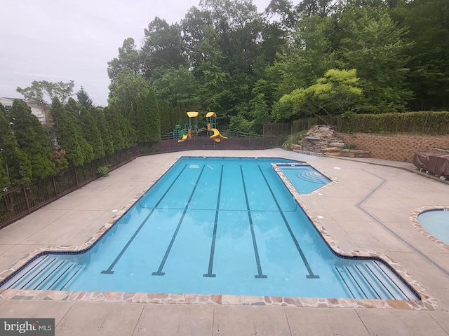 256 Silverbell Ct, West Chester, PA 19380 - view of swimming pool with a playground, a pool with connected hot tub, and a patio area