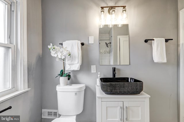 2503 W Forest Park Ave, Baltimore, MD 21215 - bathroom with toilet, vanity, and a shower