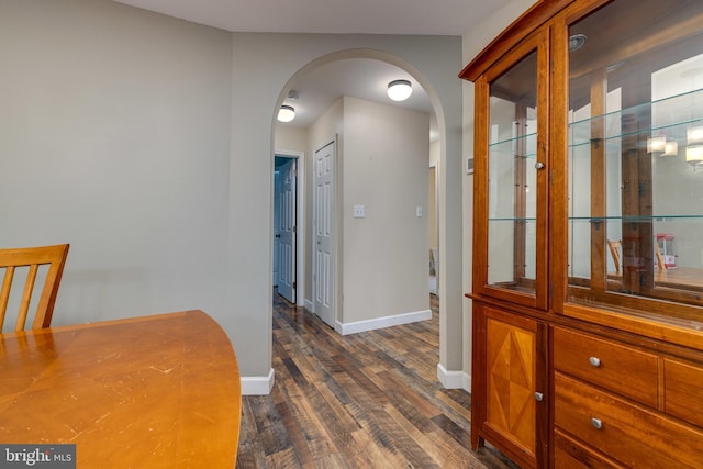 94 Eagle Ct, Woodstock, VA 22664 - hallway with arched walkways, dark wood-style floors, and baseboards