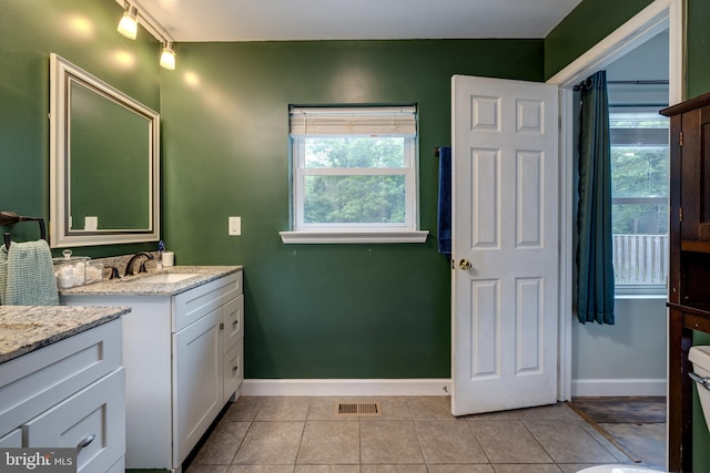 94 Eagle Ct, Woodstock, VA 22664 - full bath featuring two vanities, tile patterned floors, baseboards, and rail lighting
