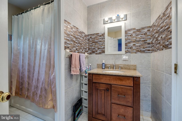94 Eagle Ct, Woodstock, VA 22664 - full bathroom featuring tile walls, vanity, shower / bath combo with shower curtain, and tile patterned floors