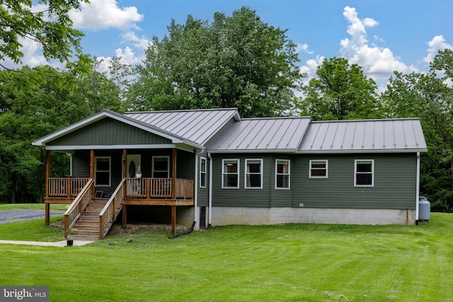 94 Eagle Ct, Woodstock, VA 22664 - view of front of house featuring a standing seam roof, a front lawn, a porch, and metal roof
