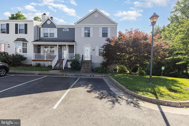 211 Westminster Ln Unit 119, Stafford, VA 22556 - multi unit property with uncovered parking, a porch, a chimney, and a front lawn