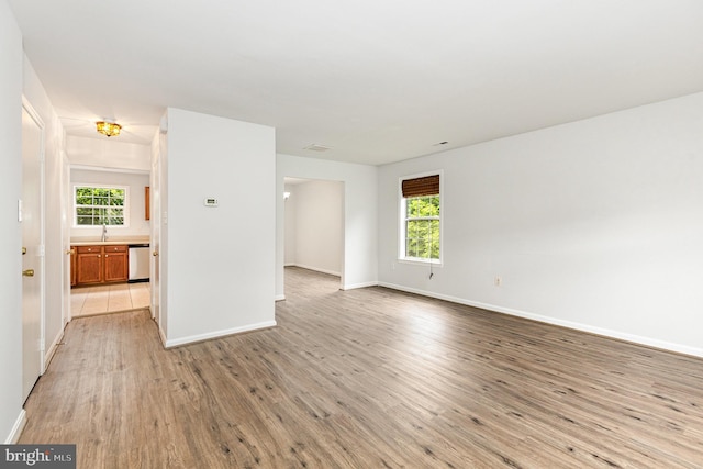 211 Westminster Ln Unit 119, Stafford, VA 22556 - spare room featuring light wood-style flooring, baseboards, and healthy amount of natural light