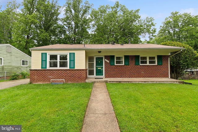 12834 Littleton St, Silver Spring, MD 20906 - view of front of home featuring brick siding and a front lawn