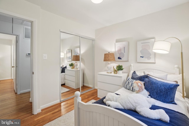 12834 Littleton St, Silver Spring, MD 20906 - bedroom featuring light wood-type flooring, a closet, and baseboards