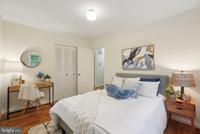 12834 Littleton St, Silver Spring, MD 20906 - bedroom featuring a closet, wood finished floors, and baseboards