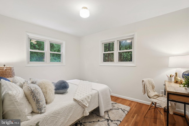 12834 Littleton St, Silver Spring, MD 20906 - bedroom with multiple windows, wood finished floors, and baseboards