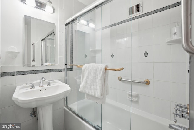 12834 Littleton St, Silver Spring, MD 20906 - full bathroom featuring shower / bath combination with glass door and tile walls