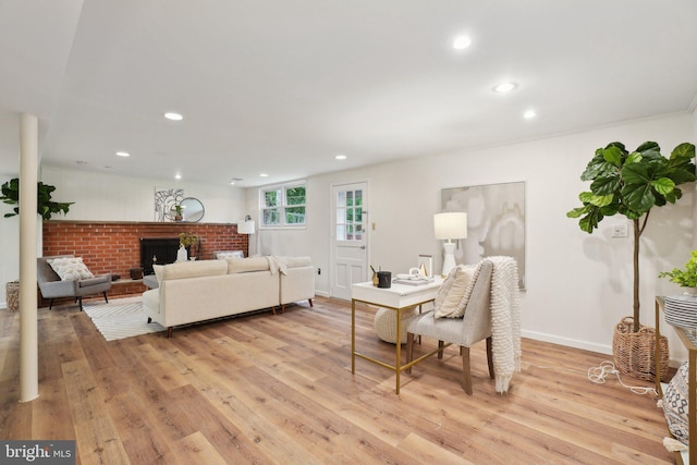 12834 Littleton St, Silver Spring, MD 20906 - living room with light wood finished floors, recessed lighting, a fireplace, and baseboards