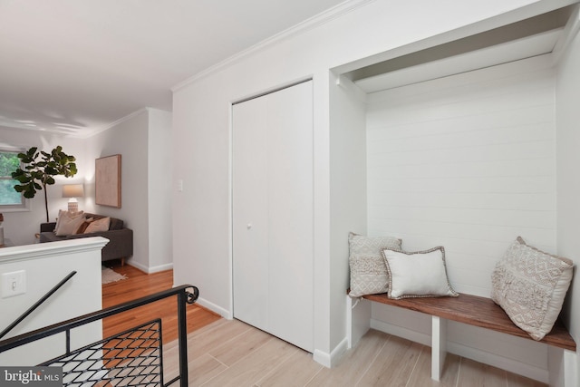 12834 Littleton St, Silver Spring, MD 20906 - mudroom featuring light wood-style floors, ornamental molding, and baseboards