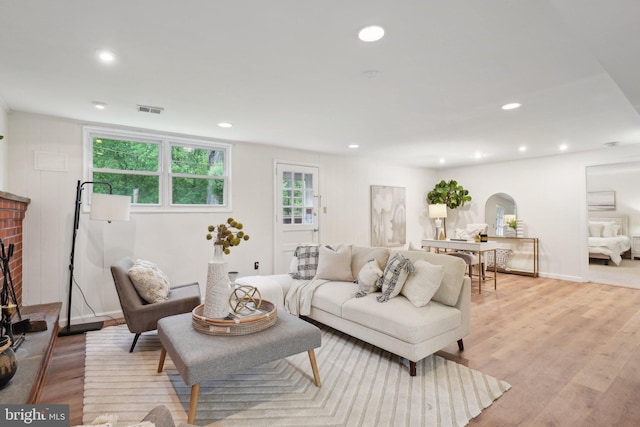 12834 Littleton St, Silver Spring, MD 20906 - living area with recessed lighting, light wood-type flooring, arched walkways, and baseboards