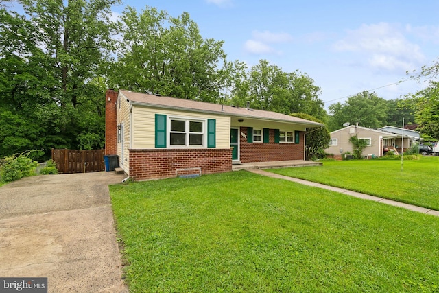 12834 Littleton St, Silver Spring, MD 20906 - view of front of home featuring brick siding, a chimney, and concrete driveway