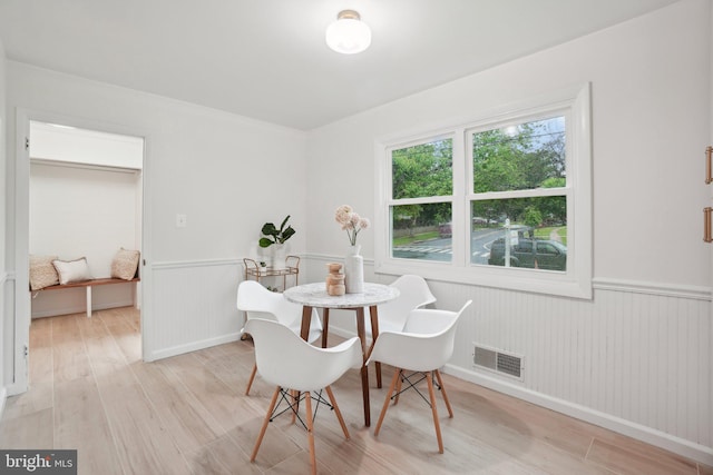12834 Littleton St, Silver Spring, MD 20906 - dining space featuring light wood-type flooring and wainscoting