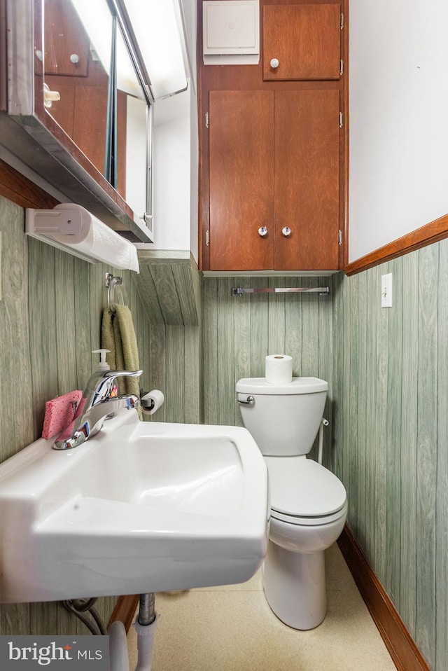 837 Broadway, Hanover, PA 17331 - bathroom with a sink, toilet, a wainscoted wall, and wooden walls