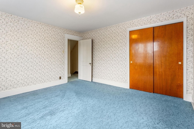 837 Broadway, Hanover, PA 17331 - unfurnished bedroom with carpet floors, wallpapered walls, and a closet
