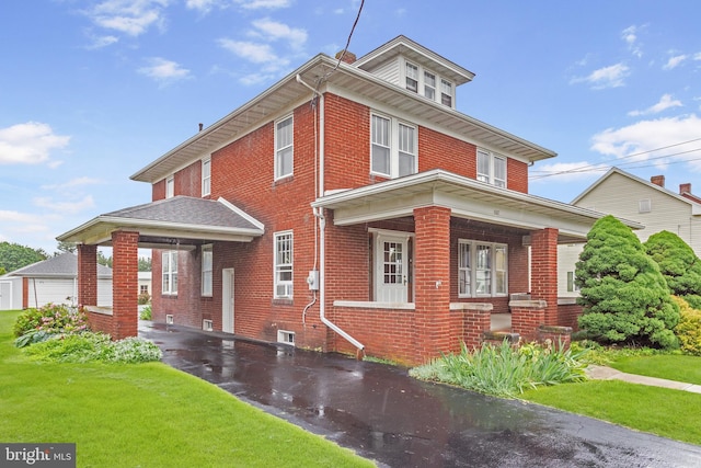 837 Broadway, Hanover, PA 17331 - american foursquare style home featuring brick siding, a front yard, and covered porch