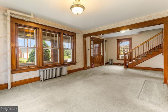 837 Broadway, Hanover, PA 17331 - carpeted entrance foyer with radiator heating unit, baseboards, wallpapered walls, and stairway