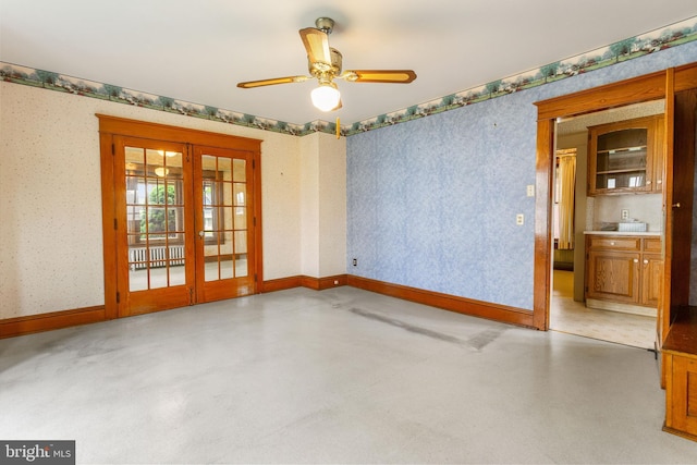 837 Broadway, Hanover, PA 17331 - unfurnished room featuring french doors, finished concrete floors, wallpapered walls, baseboards, and a ceiling fan