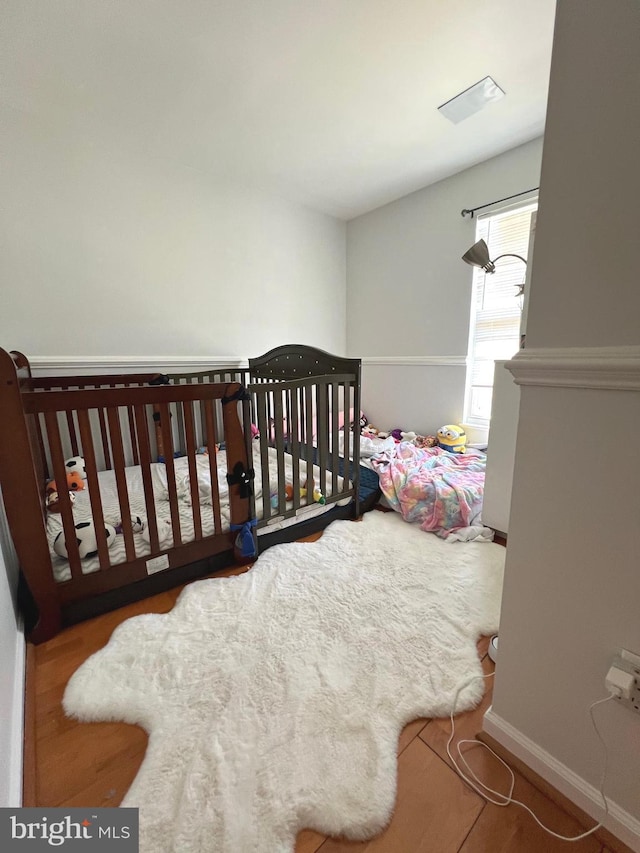 9122 Verbena Ct, Manassas, VA 20110 - bedroom with baseboards and wood finished floors