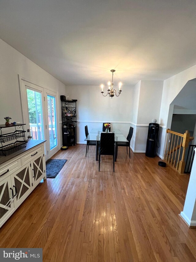 9122 Verbena Ct, Manassas, VA 20110 - dining room featuring wood finished floors and a chandelier