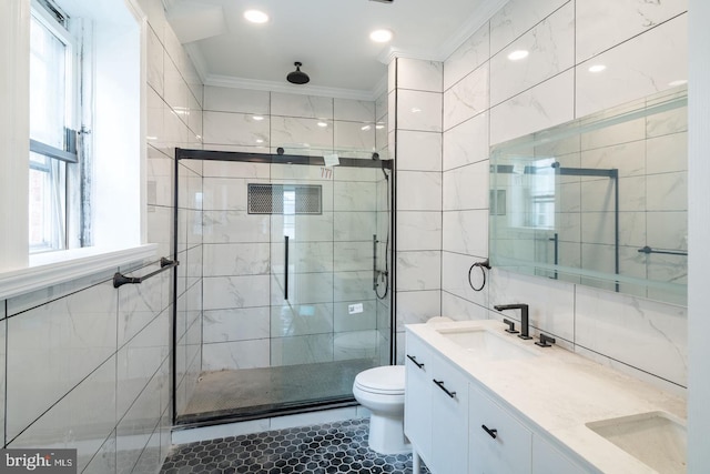 1606 Wharton St, Philadelphia, PA 19146 - bathroom featuring double vanity, a shower stall, ornamental molding, toilet, and tile walls