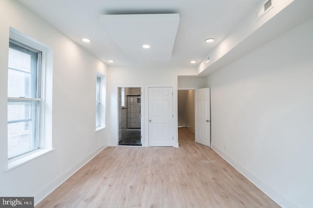 1606 Wharton St, Philadelphia, PA 19146 - unfurnished bedroom with multiple windows, light wood-type flooring, baseboards, and recessed lighting