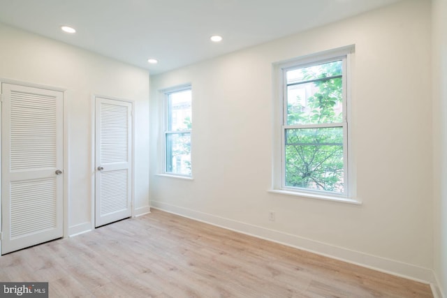 1606 Wharton St, Philadelphia, PA 19146 - unfurnished bedroom with multiple closets, light wood finished floors, baseboards, and recessed lighting