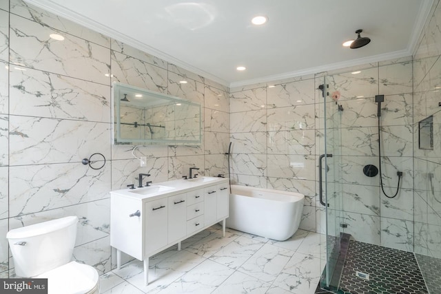1606 Wharton St, Philadelphia, PA 19146 - bathroom with ornamental molding, tile walls, a marble finish shower, a soaking tub, and double vanity