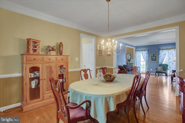 10526 Jasper Dr S, Greencastle, PA 17225 - dining area featuring a chandelier, light wood finished floors, baseboards, and ornamental molding