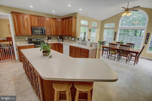 10526 Jasper Dr S, Greencastle, PA 17225 - kitchen featuring stainless steel appliances, light countertops, backsplash, ceiling fan, and recessed lighting